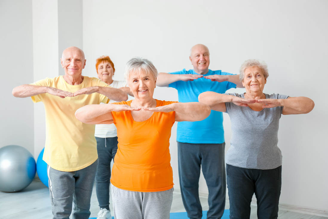 Elderly People Exercising in Gym
